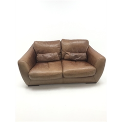  Two seat sofa upholstered in tan leather (W180cm) and matching armchair (W92cm) (2)  