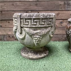 Pair of cast stone planters decorated in grapes