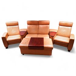 Stressless - 'Arion' four seat recliner cinema sofa, fitted with rests and drink holders, (W300cm, H101cm, D107cm), upholstered in tan leather, with matching rectangular ottoman (118cm x 60cm, H50cm)