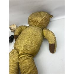 Mid-20th century woodwool filled teddy bear; and porcelain doll dressed as a WW2 evacuee