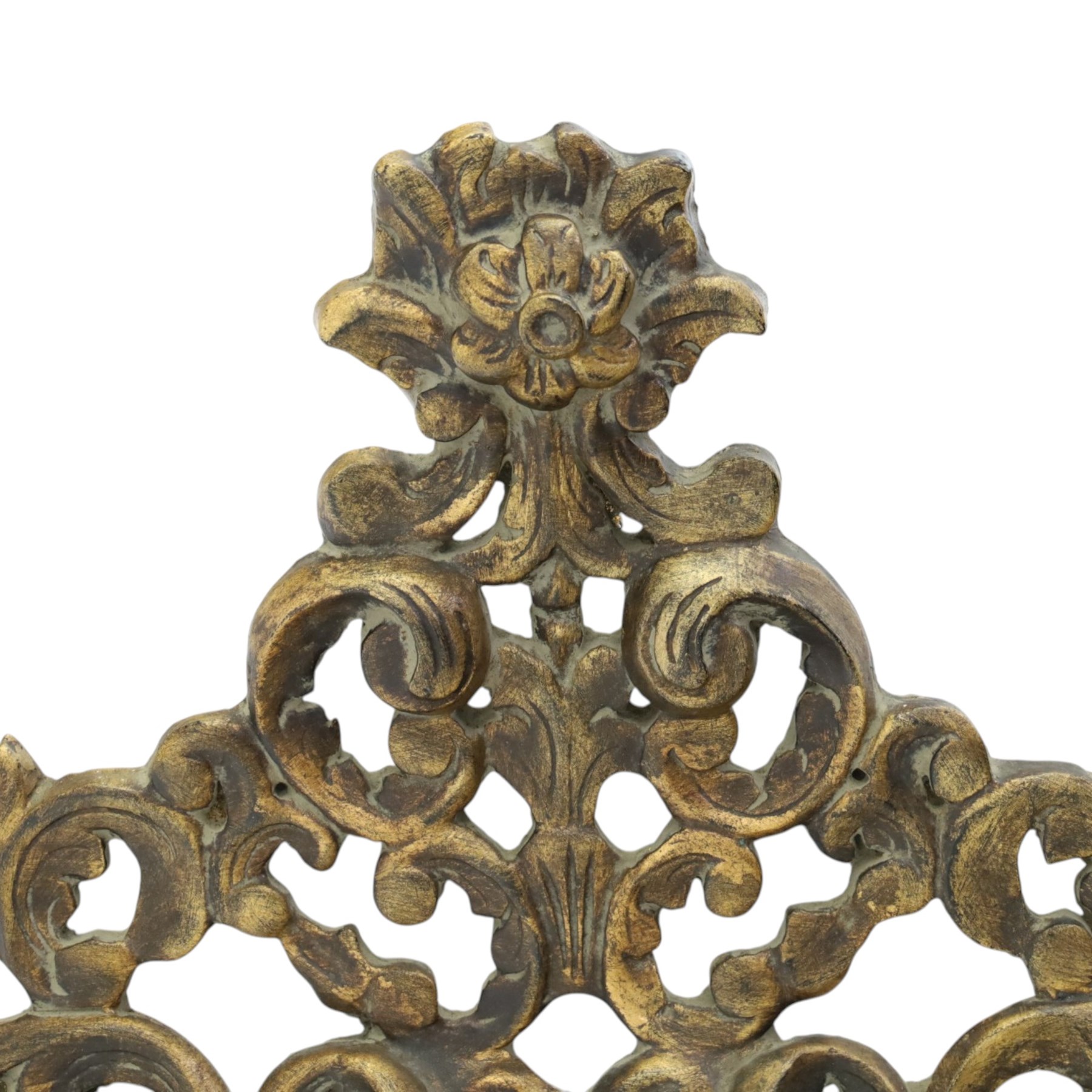 Rococo style gilt wall mirror, the shaped rectangular bevelled plate within a pierced frame of scrolling acanthus leaves, surmounted by a foliate crest