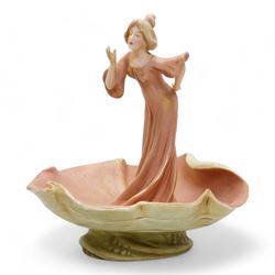Royal Dux figure of a maiden collecting water above a shell bow, H25cm and another figural dish modelled as a maiden rising out of a shell, H24cm (2)