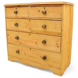 Victorian stripped pine chest, fitted with two short and three long drawers, turned wooden handles, shaped lower apron on bracket feet
