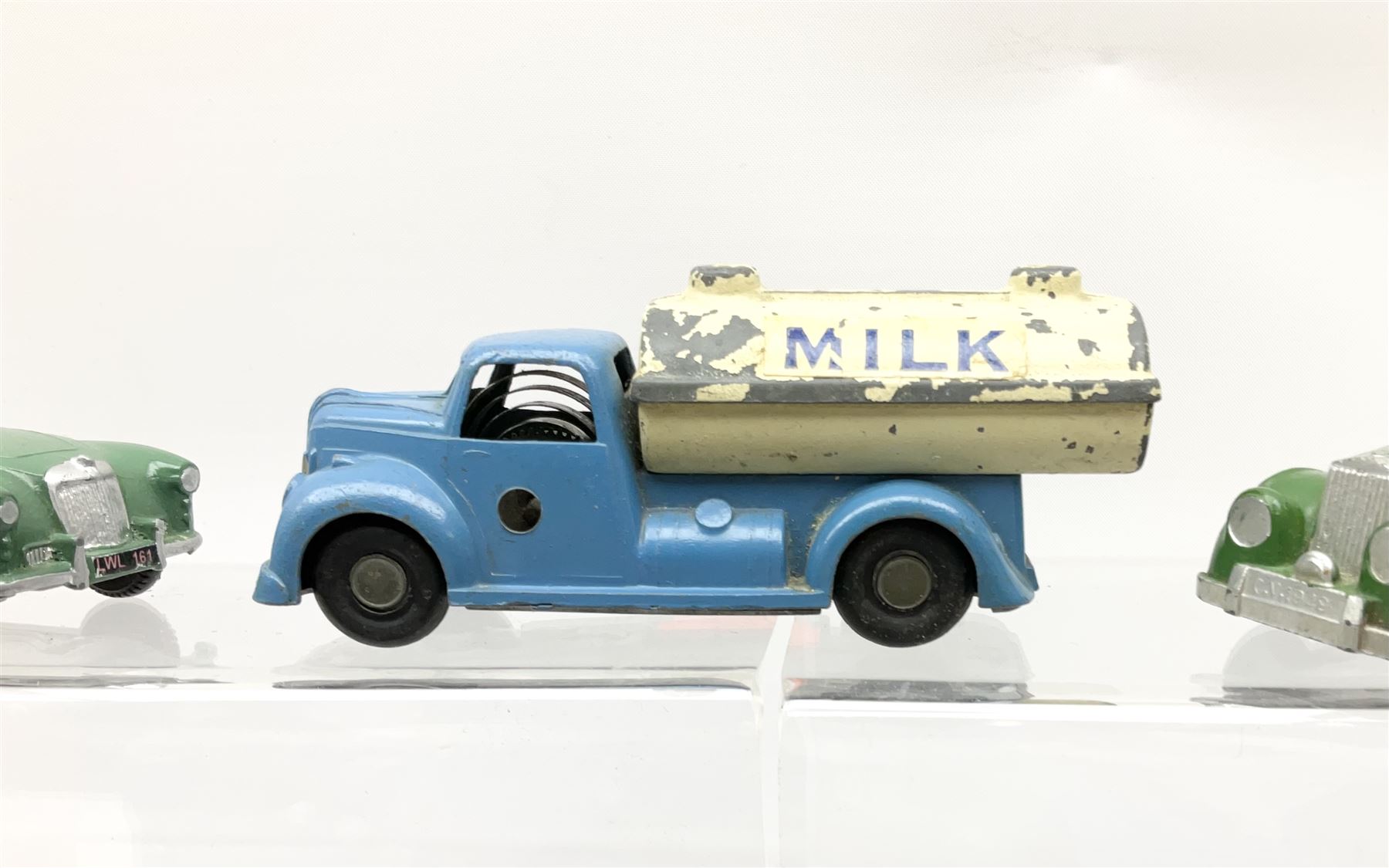 Chad Valley Wee-Kin - six unboxed and playworn clockwork models comprising Milk Tanker; Hillman Minx and another saloon car; Commer Avenger Coach; and two double deck buses; together with Tri-ang Spot-On Armstrong Siddeley Sapphire and BMW Isetta bubble car (8)