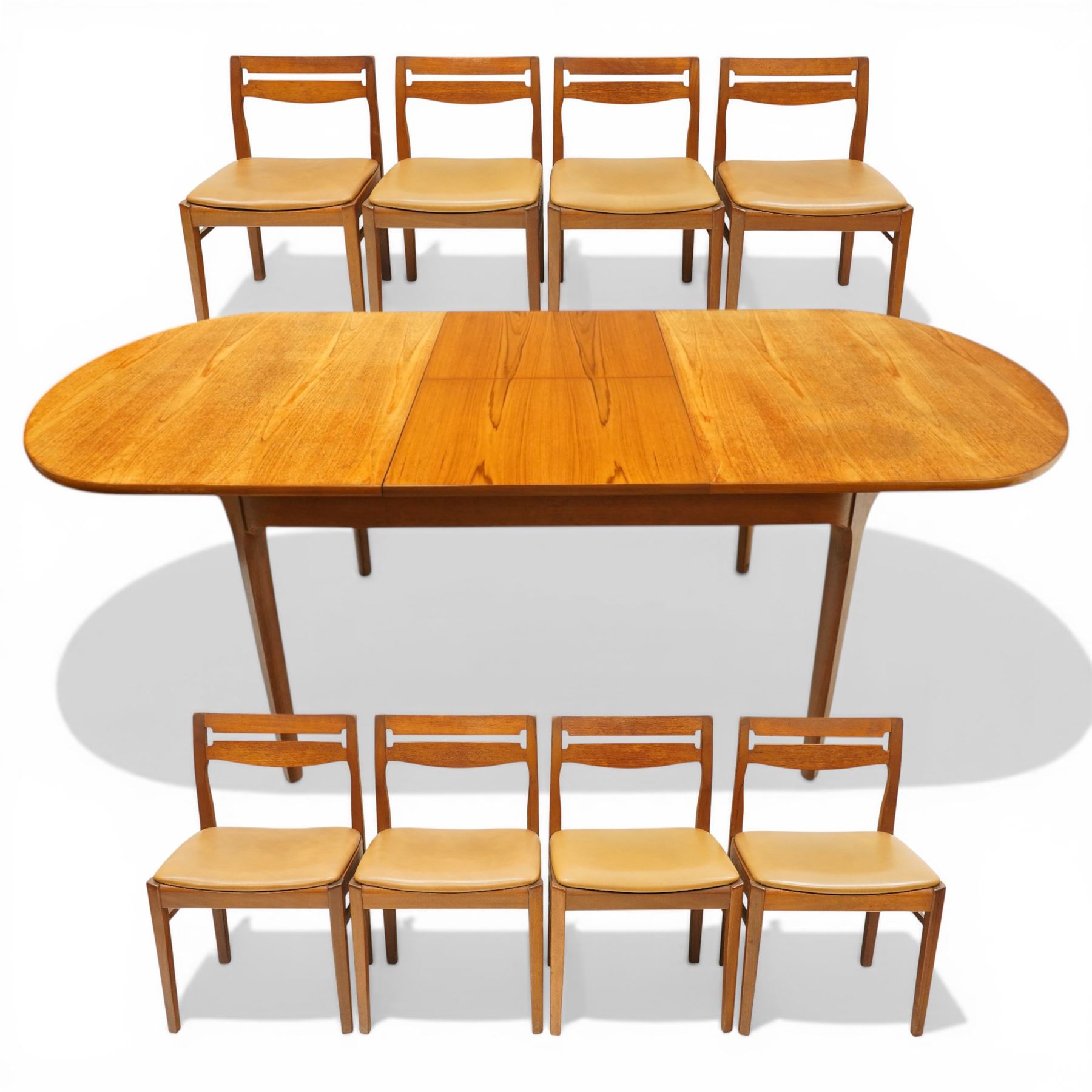 Nathan - teak oval extending dining table, together with set of eight matching low-back dining chairs with tan leather seats, extends to 203cm