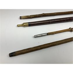Four wooden walking canes, including a carved mahogany snooker cue example, tallest H86cm