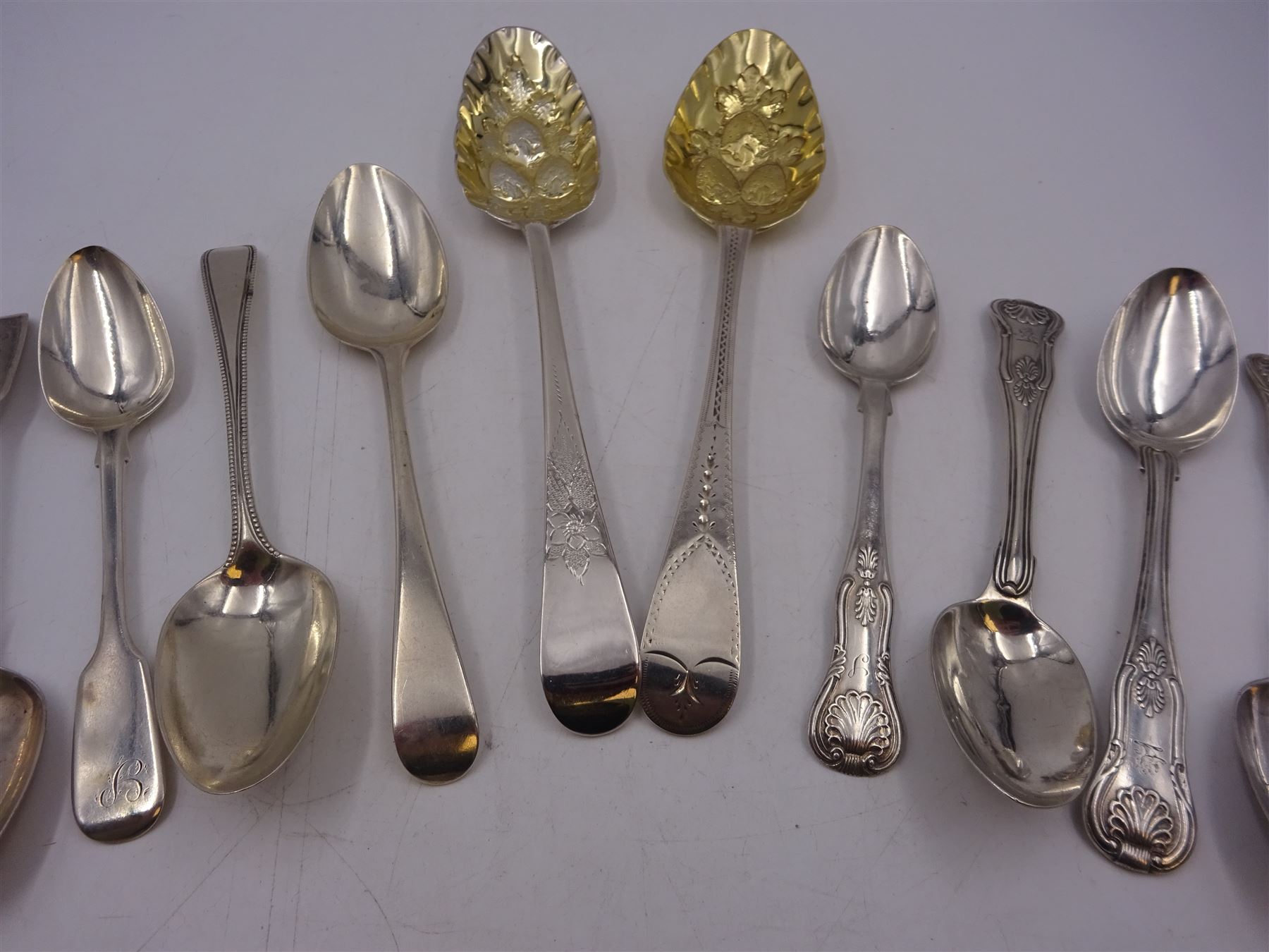 Georgian and later flatware, including two serving spoons, with later struck berry bowls, King's pattern teaspoons, mustard spoons, etc, all hallmarked 