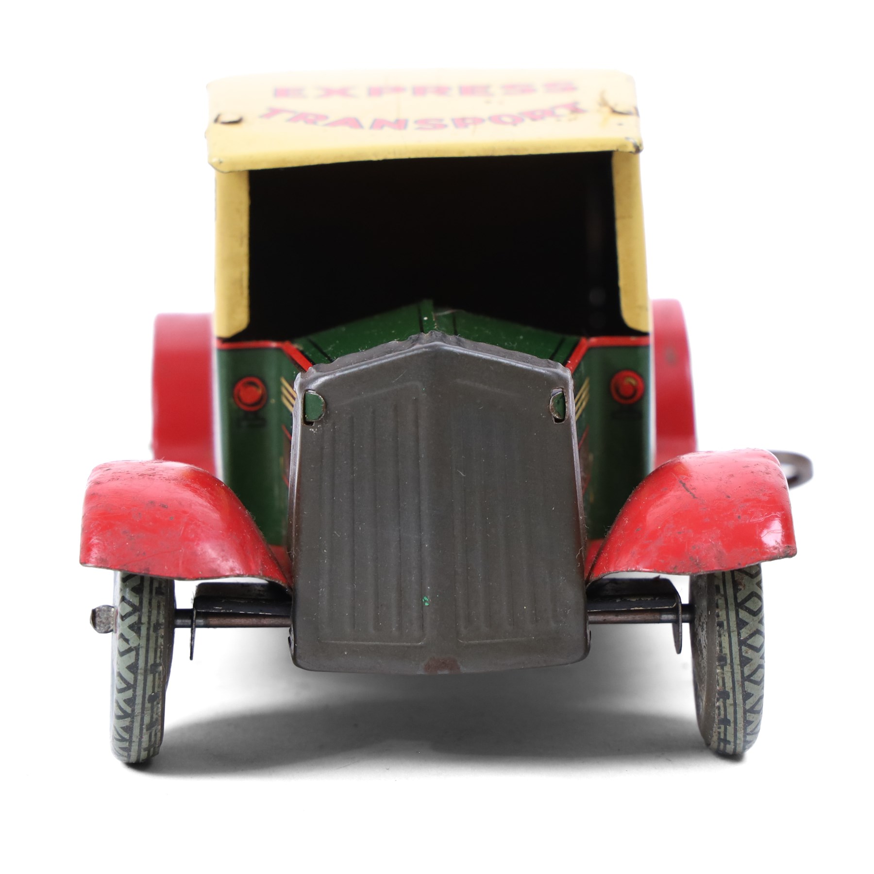 Wells Brimtoy tinplate clockwork 'Express Transport' delivery van, green body with cream roof and red highlights, with lithographed details, fixed key, H7.5cm, L17cm