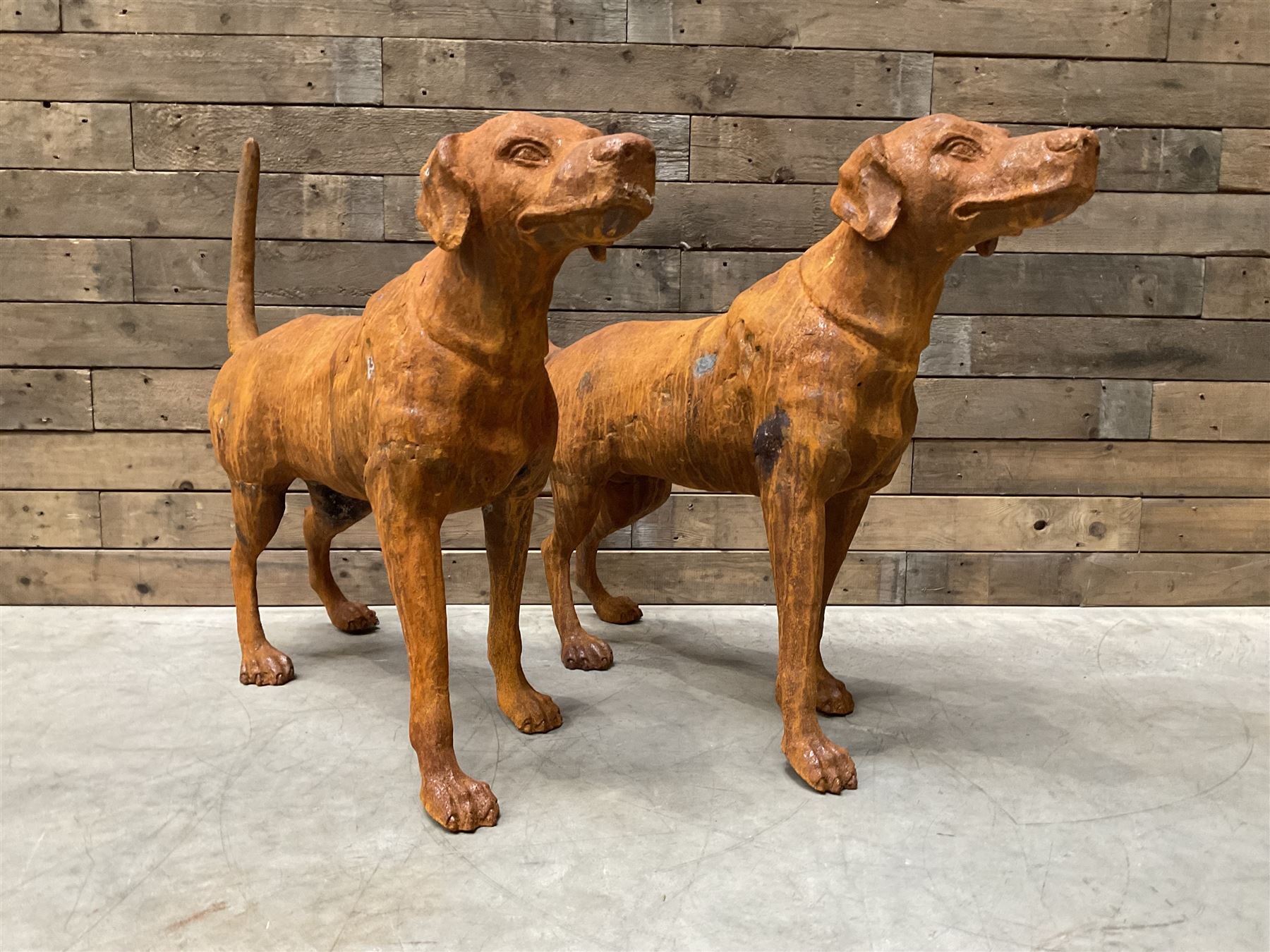 Pair of life-size heavy cast iron garden Hunting dogs