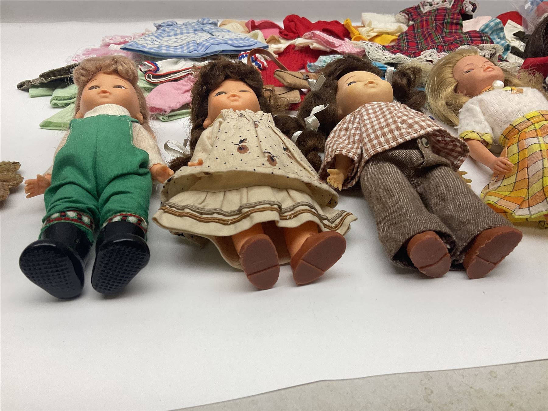 Six fashion dolls by Amanda Jane, Sindy and Barbie with various outfits, clothing and footwear