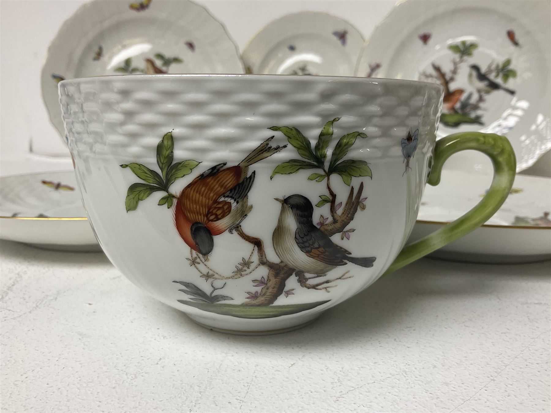 Herend of Hungary Rothschild bird pattern, part tea service, comprising two large teacups and saucers, two teacups and three saucers, milk jug, sugar bowl, five dessert plates and two side plates (18)