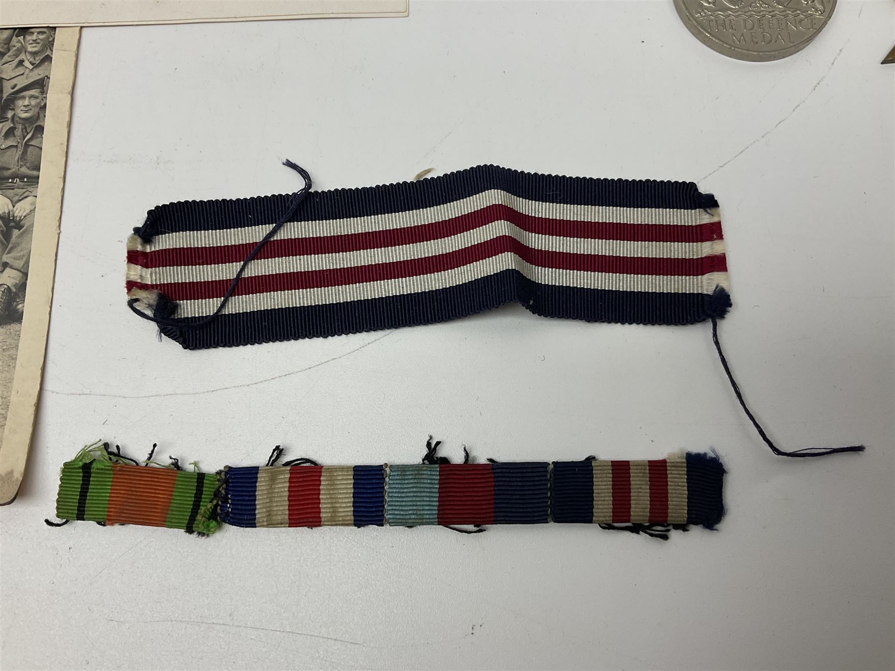 WW2 Highland Light Infantry Military Medal group of five comprising MM, 1939-1945 War Medal, Defence Medal, 1939-1945 Star and France and Germany Star; three with ribbons; awarded to 1702538 A. Sjt. A.L. Alden H.L.I.; various copies of his citation giving details of his bravery on 26 Sep 44 at Donderdonk France when he single-handedly silenced an enemy machine gun nest. The citation also mentions a further heroic act on 15 Nov 44 when he risked his life to obtain vital information on the position of enemy mines and booby traps saving the lives of many other soldiers; the collection also comes with two contemporary group photographs of his Highland Light Infantry regiment, copy photograph of him being awarded the MM by Field-Marshall Montgomery, two post-war tug-o-war medallions and other items; together with a shooting medallion awarded to Gnr. J. Alden (his brother John) inscribed 123 L.A.A. Regt. R.A. Rifle Meeting Harburg 1945 and a Life Saving bronze medallion to J. Alden April 1938