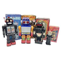 Three vintage battery operated robots comprising tin-plate Space Walk Man ME 100 Robot, Saturn the 13