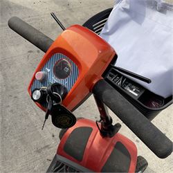 Four wheel electric mobility scooter in orange with keys and charger  - THIS LOT IS TO BE COLLECTED BY APPOINTMENT FROM DUGGLEBY STORAGE, GREAT HILL, EASTFIELD, SCARBOROUGH, YO11 3TX