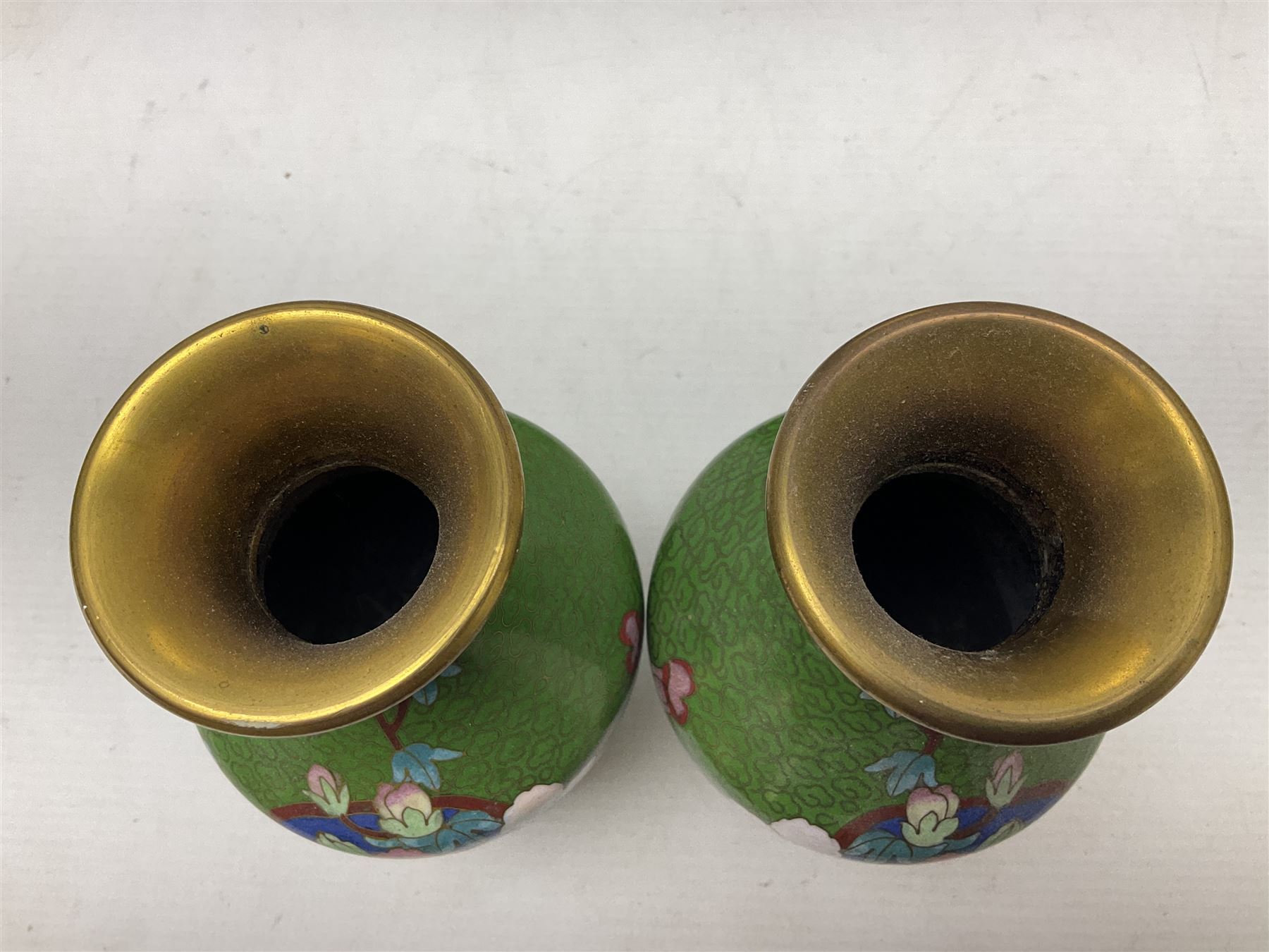 Cloisonné plate decorated with birds and flowers, together with a pair of Cloisonné vases of baluster form 
