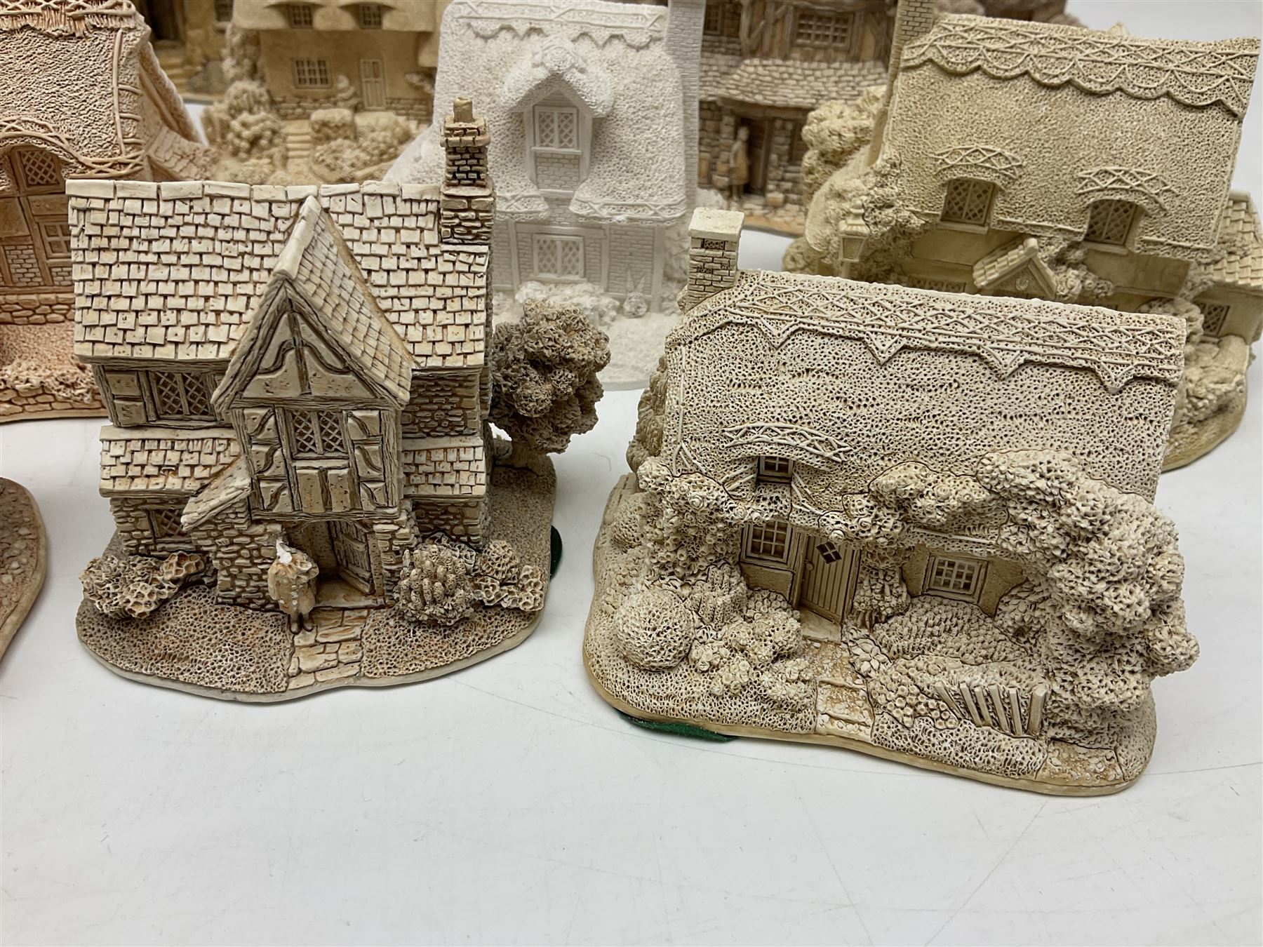 Twenty-three Lilliput Lane models from the Paint Your Own collection, to include Catmint Cottage, Sugar and Spice, Gypsy Cottage, Ruby Cottage and Little Birch, some boxed