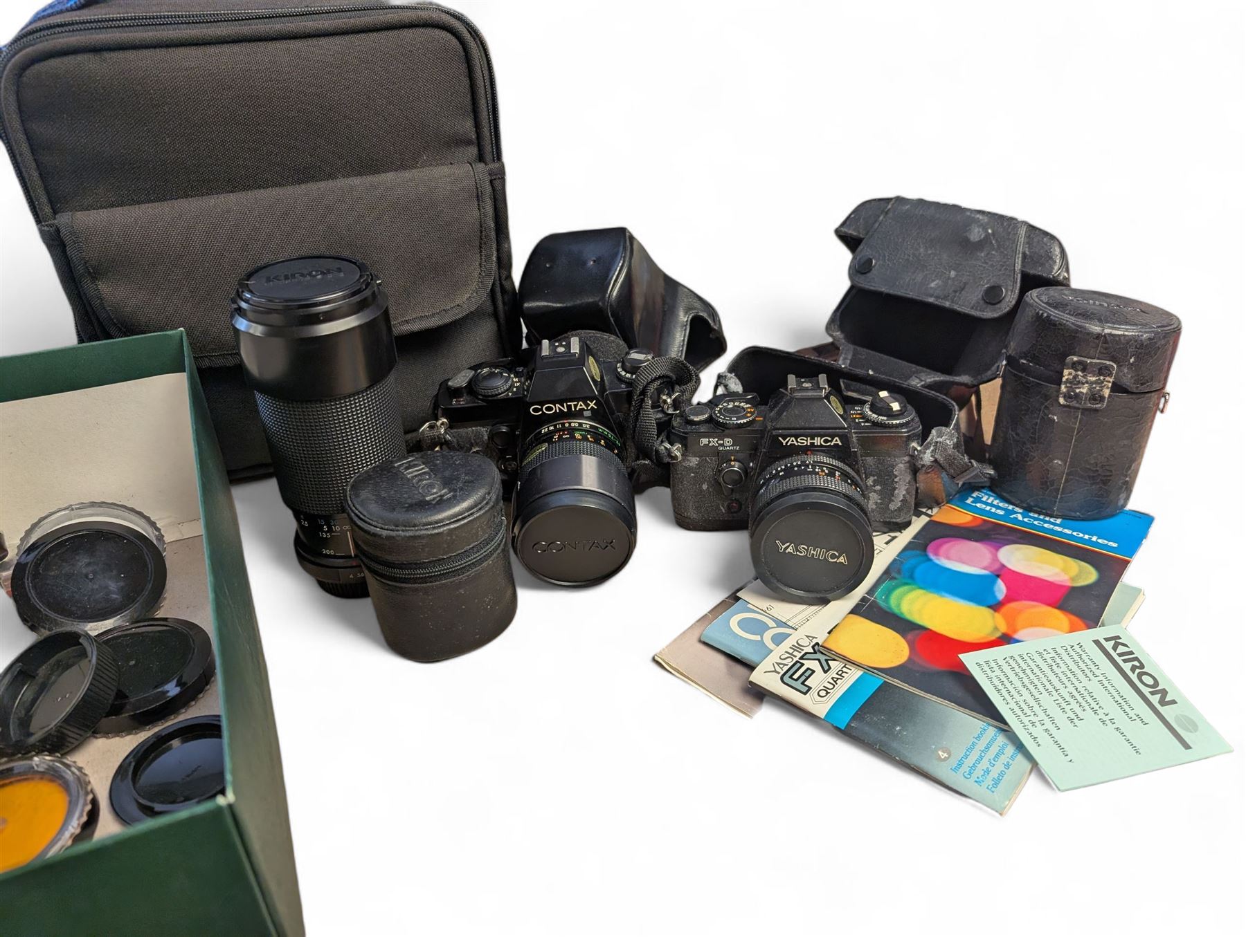 Contax SLR camera with a Yashica ML Zoom 42-75mm 1:3.5-4.5 lens, in case with accessories, together with a Yashica FX-D Quartz SLR camera with a Carl Zeiss Planar 1.7/50 lens, with filters, instruction booklets and other accessories