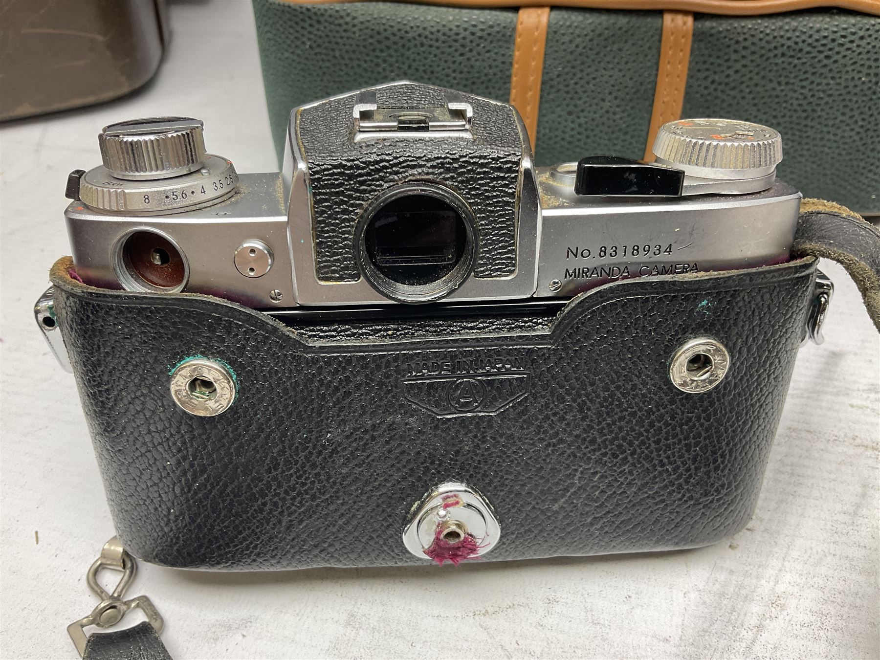 Miranda Sensorex camera body, Miranda Sensorex II camera body with 'Auto Miranda 1:1.8 f-59mm' lens, 'Auto Miranda 1:2.8 f-135mm' lens, 'Auto Miranda 1:3.5 f-200mm' lens, 'Auto Miranda 1:2.8 f-28mm' len, Agfa plate camera with 9cm x 12cm plates and other camera equipment including Miranda camera bag