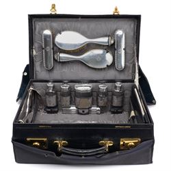 Early 20th century ladies leather travelling dressing case marked Walker & Hall, with wate...