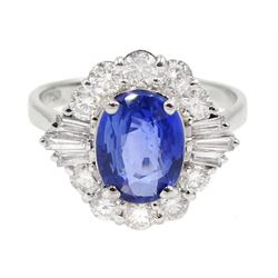 18ct white gold sapphire and diamond cluster ring, the central oval sapphire of approx 2.10 carat, with tapered baguette diamonds and round brilliant cut diamond surround, stamped 750