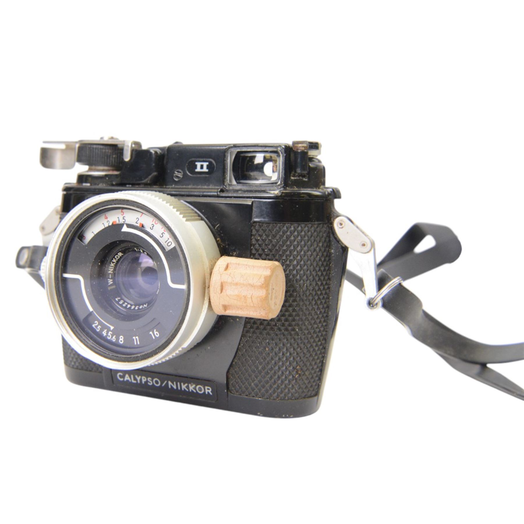 Nikon Calypso/Nikkor underwater camera serial no. 1051523, with a W-Nikkot 1;2.5 f=35mm lens serial no. 364257, together with a Nikonos Close Up Unit and an Enbeeco Compass Bearing Monocular 7x50 Field 7.1, contained within canvas soft carry case