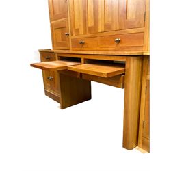Large contemporary cherry wood break-front wall unit, the banded cornice over double cupboard with bifold doors and two drawers, flanked by four single cupboards, the base fitted with four drawers over four cupboards (W263cm, H216cm, D68cm); and a cherry wood cabinet, fitted with double cupboard over two short and two long drawers, with faux drawer facias (W81cm, H138cm, D66cm)