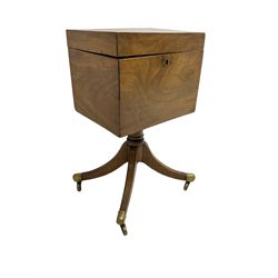 Regency mahogany cellarette on stand, rectangular top with hinged lid, raised on turned pedestal terminating in quadrupod base with brass cups and castors