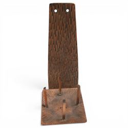 Pair of brutalist candle holders, together with similar wall sconce