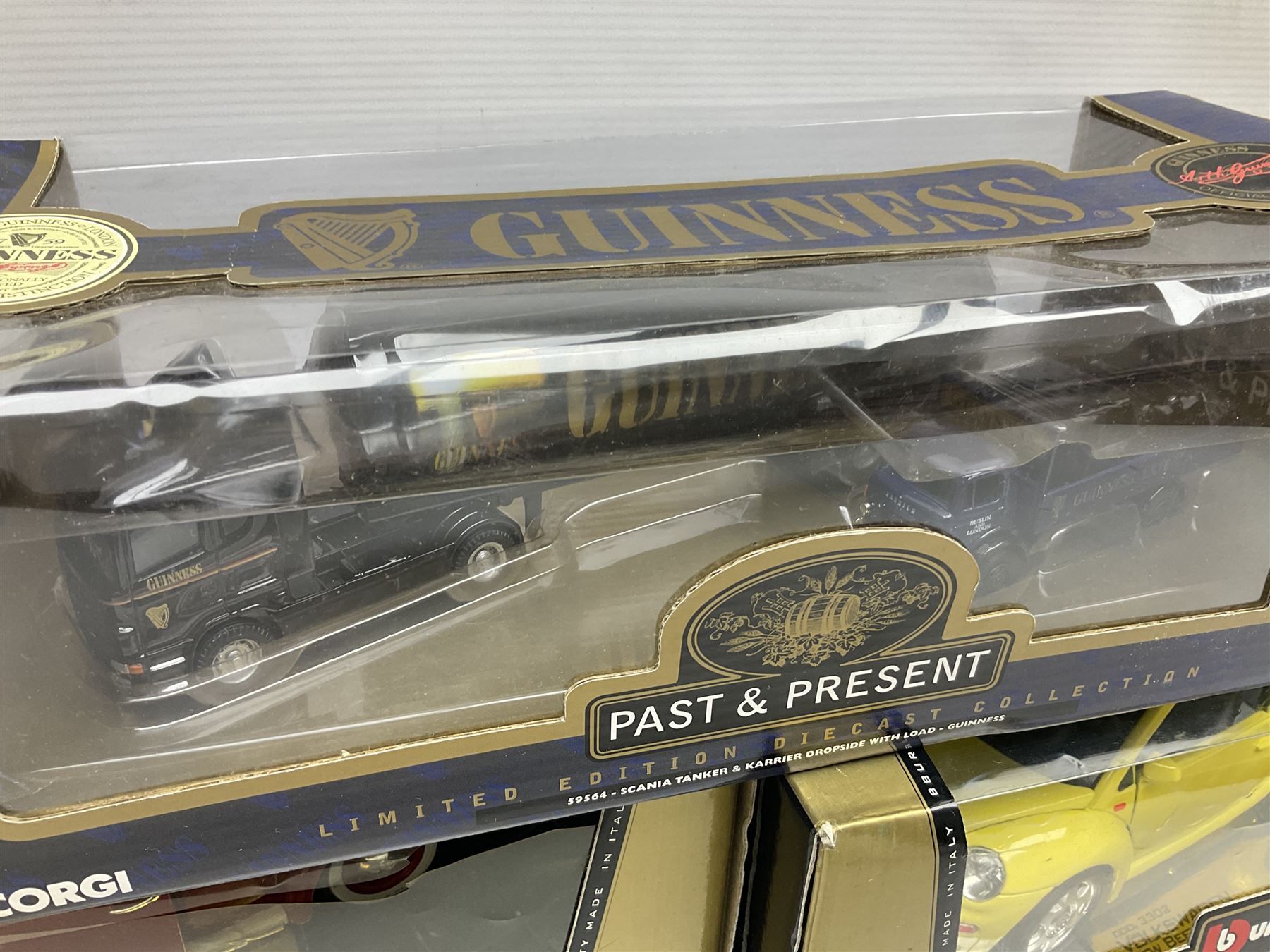 Two Bburago 1:18 scale die-cast models - Volkswagen New Beetle 1998 and Volkswagen Kafer-Beetle 1955; Corgi CC99109 Cooper 'S' three-piece set on dashboard stand; Saico 1956 Morris Minor 1000 limited edition twin-pack; and Corgi limited edition 59564 Guinness Scania Tanker and Drop-side lorry set; all boxed (5)