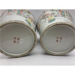 Pair of Chinese vases and covers, each of baluster form with domed cover and finial, decorated with figures in a landscape, with Yongzheng Nian Zh mark beneath H38cm