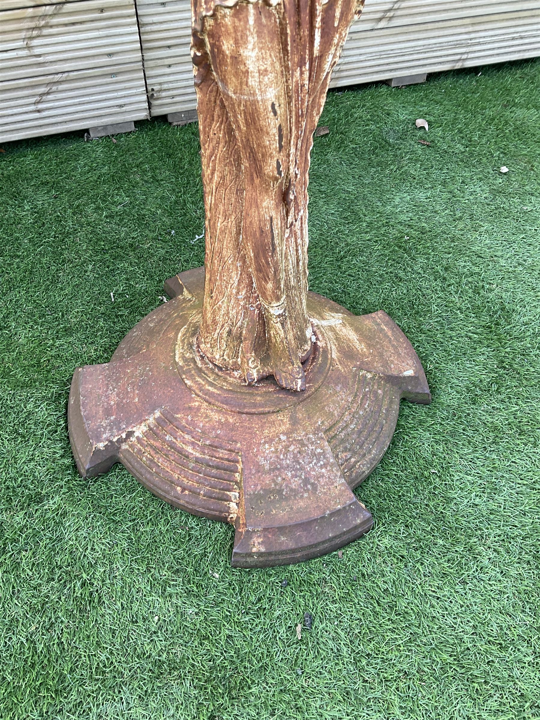 Early 20th century cast iron figure of a lady, on stepped circular base - THIS LOT IS TO BE COLLECTED BY APPOINTMENT FROM DUGGLEBY STORAGE, GREAT HILL, EASTFIELD, SCARBOROUGH, YO11 3TX