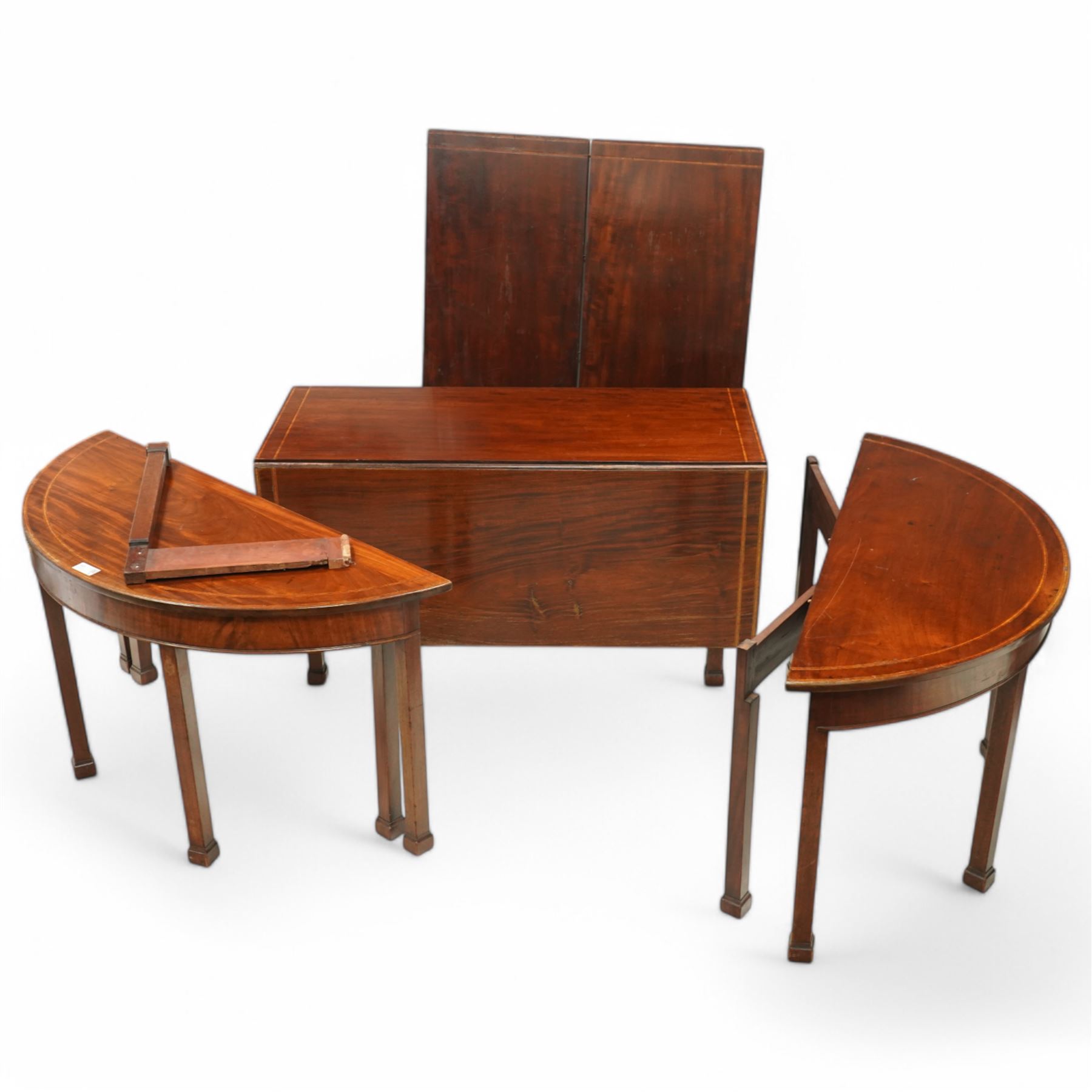 19th century and later mahogany extending dining table (12' 7’'), two D-ends, central drop-leaf table and two additional leaves, with satinwood bands, on square supports with block feet (lacking forks)