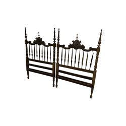 Pair Spanish stained beech single 3' bedsteads, spindle turned backs and carved with scrolling floral decoration 