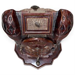 Deville & Cie of Charleville - early 20th century Art Deco cast iron and burgundy enamel 'Cristal' wood burning stove, hinged vent over lattice glazed door and ash drawer, on shaped geometric base, circa 1920