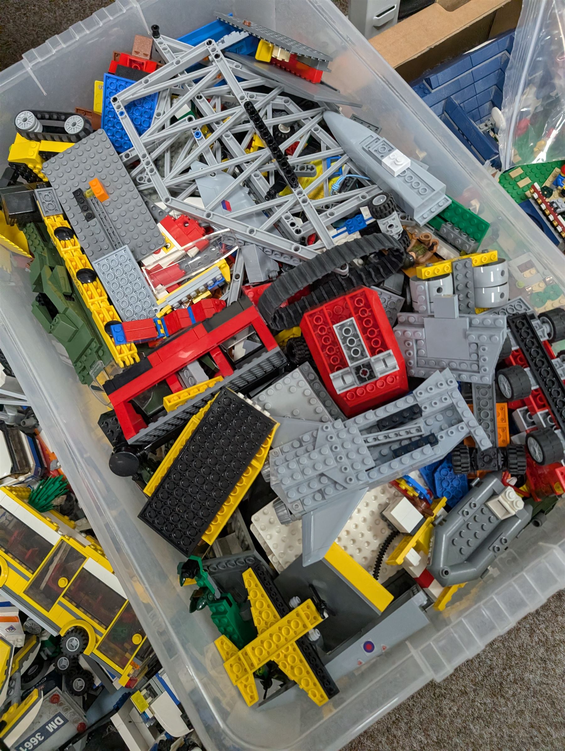 Large collection of Lego, including partially built vehicles, Police Station, Lego Creator 31010 and a collection of Lego instruction booklets