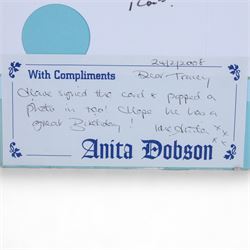 Birthday card and postcard, each signed by Brian May and Anita Dobson, with a personalised Anita Dobson compliment slip dated 2008, in glass frame