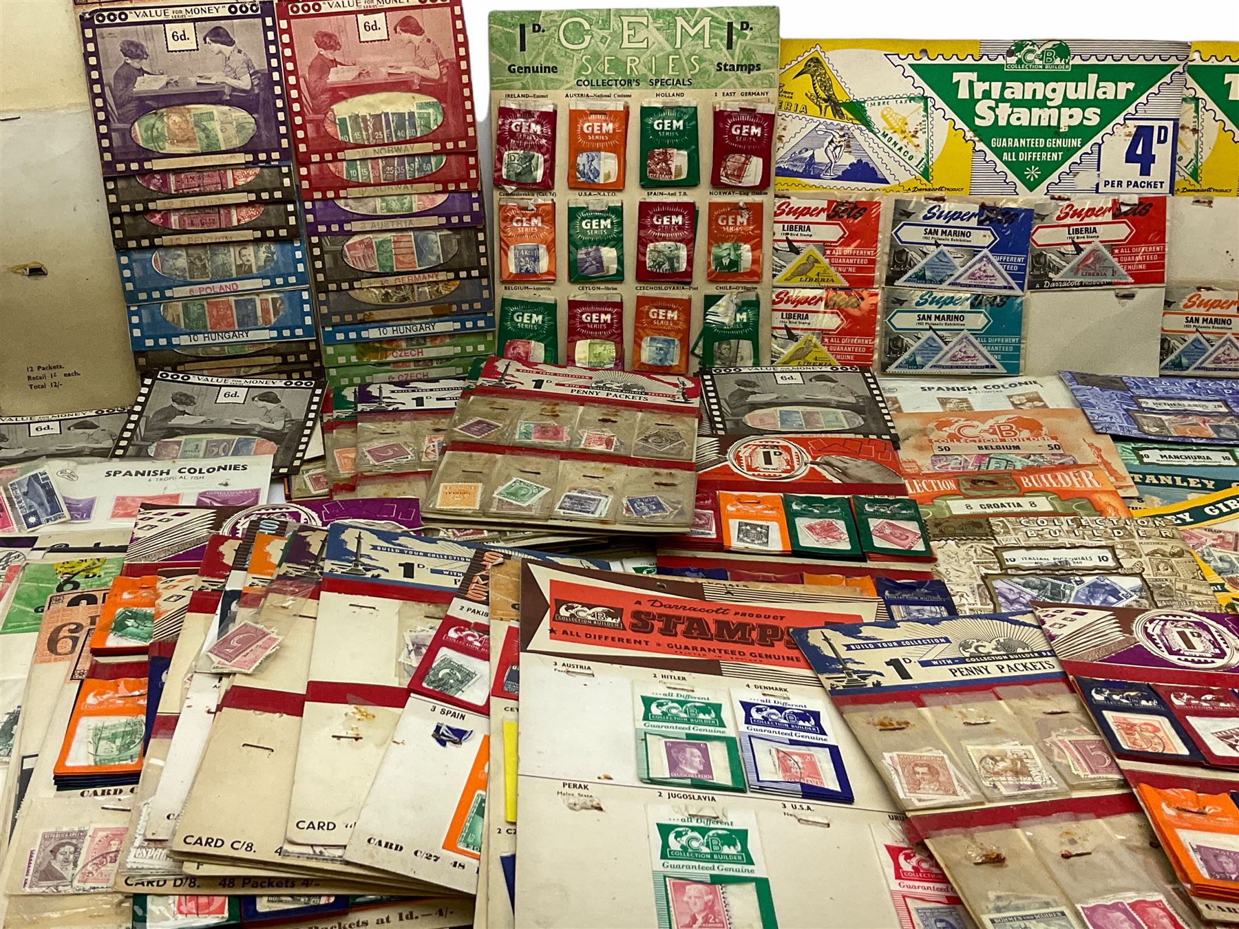 Collection of stamps including packets still mounted to the original shop cards, reading 'A Darracott Product Stamps 1d per pkt' etc, Countries include China, Spain, Argentina, Liberia, Denmark etc, in one box