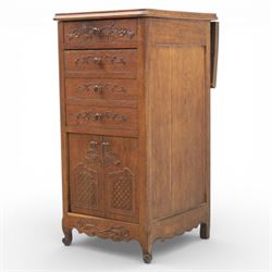 20th century French style oak bedside chest of pedestal form, the top with rounded moulded edge with drop leaf to the back, above five carved drawers with applied scroll ornament and turned knobs, the cupboard base with twin carved doors with diamond lattice panels, with shaped apron and bracket feet