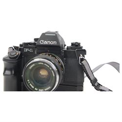 Canon F1 camera body, serial no. 223511, with 'Canon FD 35mm 1:2 FD' lens, serial no.23164, shoulder strap and Canon AE Power winder, serial no.174705