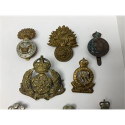 Nineteen Yeomanry metal cap badges including Derbyshire, Northamptonshire, Essex, Glamorgan, Staffordshire, City of London, Surrey, Shropshire, Hertfordshire etc; together with eleven Fusiliers badges including Lancashire, Royal Welch, Northumberland etc (30)