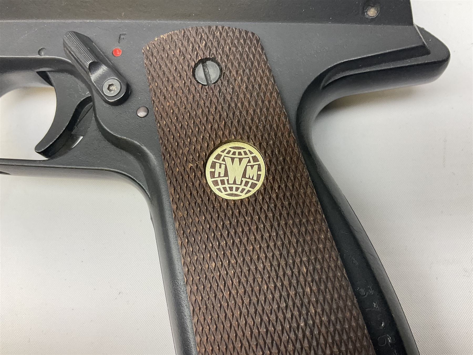 H. Weihrauch HW45 air pistol, .177 calibre, over-lever mechanism, chequered grip No.372679 L31cm; and quantity of pellets