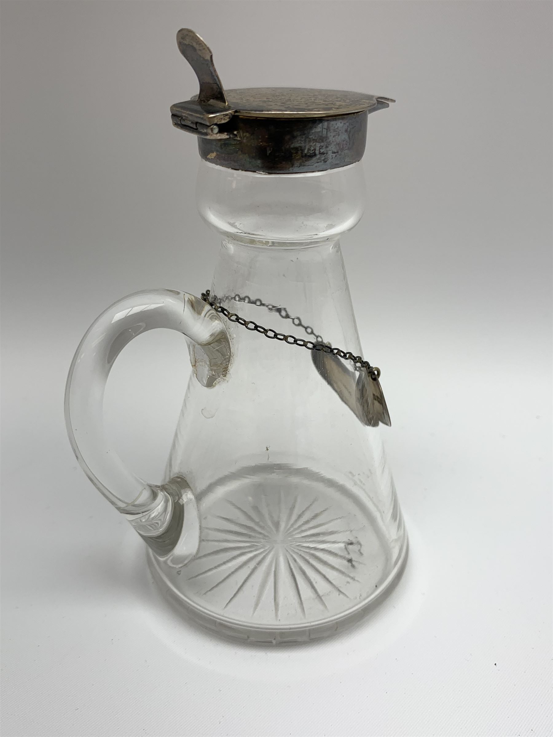 Edwardian silver mounted whisky noggin, of tapering cylindrical form with hinged flat cover, H12cm, together with a silver whisky label, each hallmarked H B Johnson & Co, London, whisky noggin dated 1906, label 1910