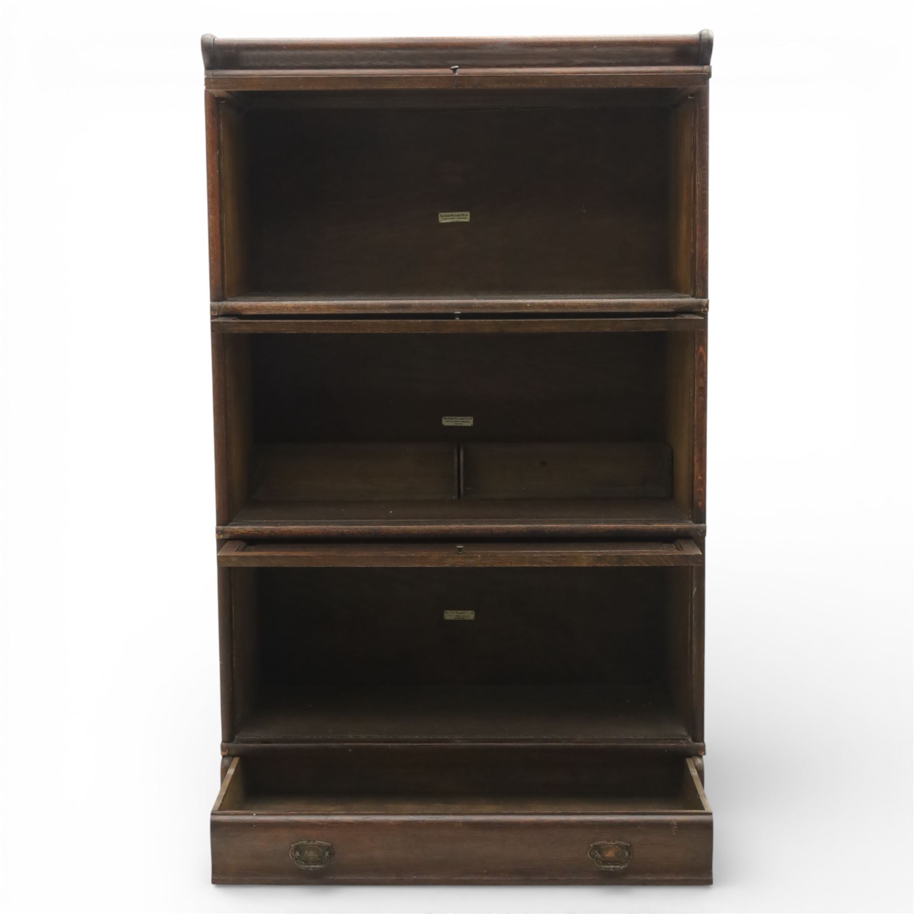 Globe Wernicke - early 20th century three sectional stacking library bookcase, two glazed sections above a panelled section, on a plinth base with inbuilt drawer
