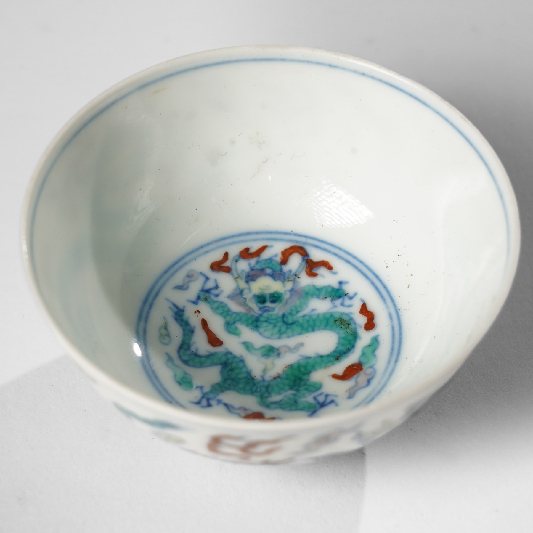 Chinese doucai wine cup, painted with a dragon, apocryphal six character Yongzheng mark to base, H3.5cm D7.5cm 