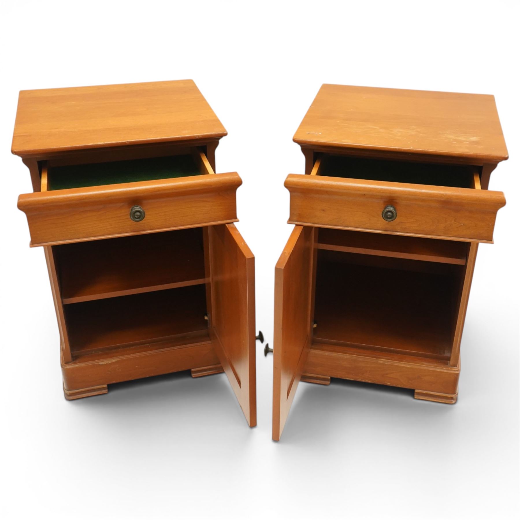 St Michael - pair of cherrywood bedside tables, single drawer above a fielded panel door, brass pulls, raised on a plinth base