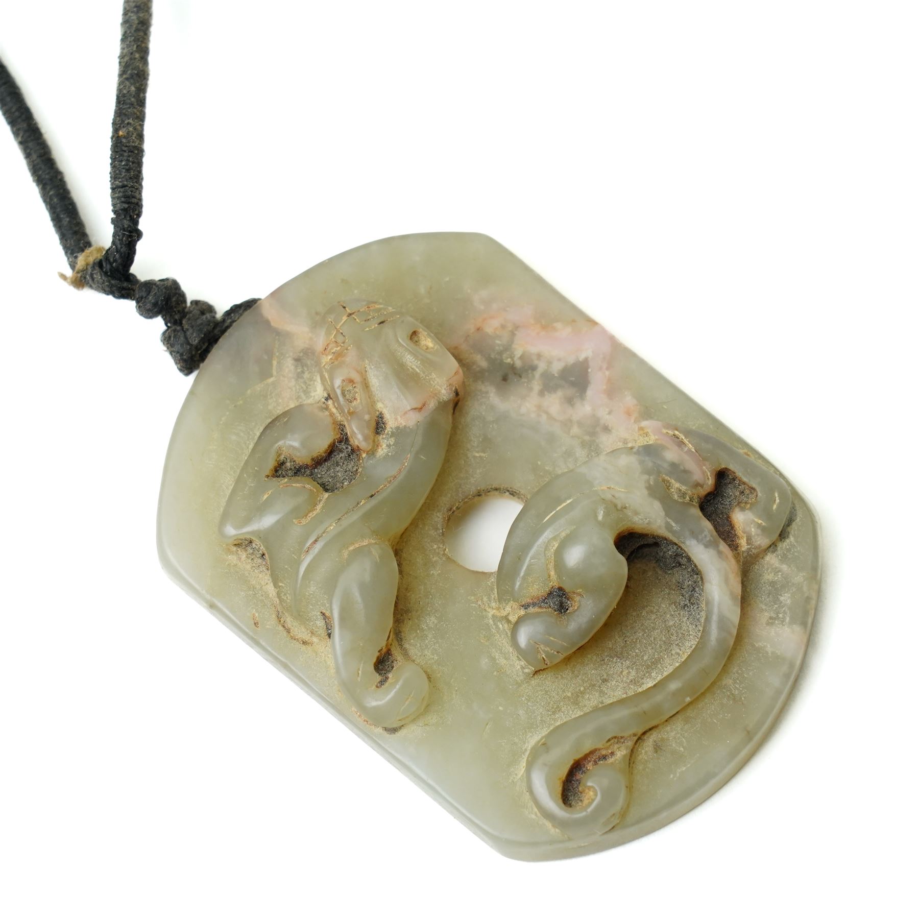 Set of three Chinese carved green hard stone pieces, depicting dragons and clouds, largest W5cm 