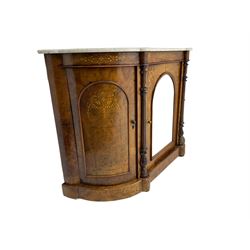 Victorian figured walnut credenza, shaped front with white marble top, the frieze inlaid with scrolling foliate decoration, central arched mirror glazed door flanked by two curved doors, turned and carved half pilastered with fluted decoration, on plinth base