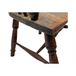 19th century provincial elm and beech Windsor armchair, shaped cresting rail over stick back with pierced and shaped splat, the dished seat on turned supports united by turned stretchers 