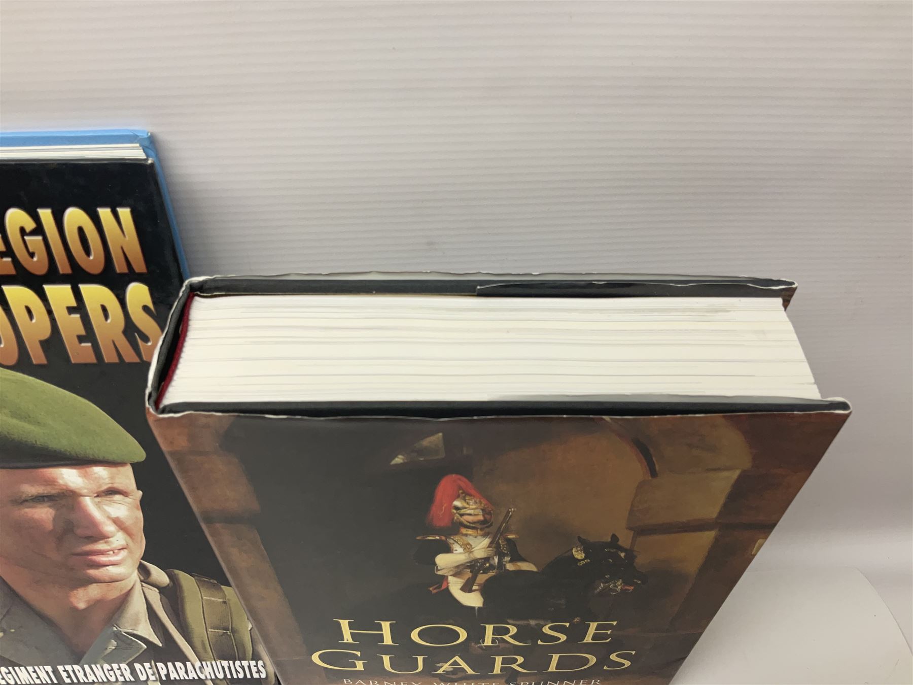 Seven military reference books - Histoire Mondiale Des Parachutistes; Yves Debay: French Foreign Legion  Paratroopers; Bragg & Turner: Parachute Wings; Barney White-Turner: Horse Guards; and three works on uniforms/standards (7)