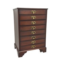 John Austin Furniture Ltd. - mahogany music cabinet, fitted with eight fall front drawers